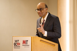 Tharman speaks at a podium