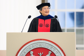 Lisa Su speaks at podium on stage.