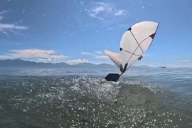 An aerial-aquatic robot flying out of a body of water