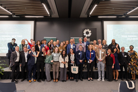 About 40 people pose for a photo.