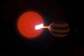A red sphere, left, sucks energy out of a brown sphere, causing a patch on the red sphere to glow white hot.