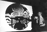 President Charles M. Vest shares some of his expertise in holographic interferometry as the "mystery guest lecturer" in Professor Stephen Benton's class on holographic imaging.