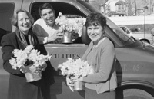 Getting ready to deliver daffodils are (left to right) Janet Plotkin, service project vice president of the MIT Women's League and coordinator of Daffodil Days; Rui Borges, operations supervisor coach; and Penny Guyer, manager of mail services.