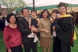Tiauw H. Go (far right), a newly minted PhD in aeronautics and astronautics, holds his 17-month-old son, Jusvin. Other members of his family who shared the day were (from left) his mother Ratmawati Go, his father Sik Go (holding Jusvin's twin brother, Jason) and his wife Mey Go.