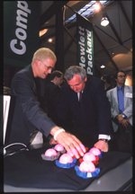 Media Lab PhD candidate Rob Poor (left) explains his research project, Nami, to Ireland's prime minister Bertie Ahern at an event celebrating the opening of MediaLabEurope (MLE) in Dublin.