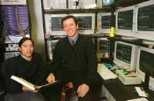 Graduate student Kenway Louie (left) and Professor Matthew Wilson sit in front of computer monitors that display data on rats' dreams.
