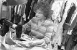 MIT costume designer Leslie Cocuzzo-Held sews costumes in her workshop.