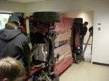 The Beetle is maneuvered down a hallway while tipped on its side.