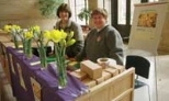 Eva Roos (left) and Susan Goldblatt of the Women's League sell daffodils in Lobby 10 to benefit the American Cancer Society.