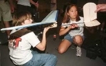 With their glider contest entry are sophomores Elizabeth Bly (left) and Malia Kilpinen.