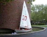 Hacks that have appeared recently include a "crack" and weight reading "48 units" on the Great Dome (top); a banner paying tribute to the late science fiction writer Douglas Adams, also on the Dome; and a Tech Dinghy afloat in the moat around the MIT Chapel.