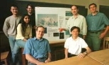 Professor Nicholas Makris (second from right, standing) holds an acoustic sensor that his lab is developing. His research group hopes the sensor will help scientists learn whether there is a liquid ocean under the ice of Jupiter's moon Europa. The group includes (left to right) Sunwoong Lee, Purnima Ratilal, Josh Wilson, Michele Zanolin and Yi-San Lai (both seated at table), and Aaron Thode