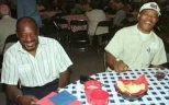 Arnold Carter of Facilities (left) and Virgil Foster enjoy themselves at the picnic. The Quarter Century Club is made up of MIT employees with 25 years of more of service.