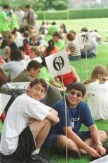 LEFT: Freshmen load up on food as they get acquainted with MIT.ABOVE: Dean for Student Life Larry Benedict is a "victim" of the "survivor" spoof duringopening ceremonies for freshmen.RIGHT: Freshmen orientation groups meet ouside Kresge after the opening ceremonies.
