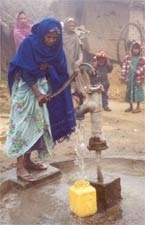 Nepali woman collects water from a tubewell.