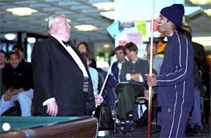 Anish Parikh shares a laugh with pool expert Jack White at White's Student Center demonstration.