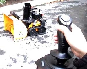 A frame from a video made by the Orange Team in 2.009 shows the Niveus snowblower being guided via remote control.