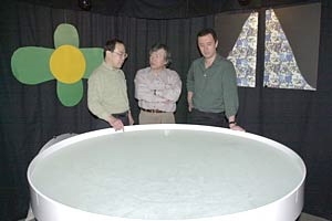 Research scientist Kazutoshi Nakazawa  (left), Professor Susumu Tonegawa (center) and Professor Matthew Wilson stand  next to the water tank where mice were tested for their memory of the location  of a submerged platform.