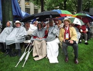 Members of the Class of 1952 who braved the rain for their 50th reunion        included Richard Daly (center, with crutches next to him), Benjamin Boley (to Daly's left) and Arnold Kramer (in the yellow jacket).