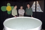 Research scientist Kazutoshi Nakazawa (left), Professor Susumu Tonegawa (center) and Professor Matthew Wilson stand next to the water tank where mice were tested for their memory of the location of a submerged platform.