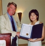 William Watson (left), professor of history and housemaster of Baker House, presents the Yngve Raustein Award to sophomore Namiko Yamamoto.