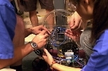 As the moment of competition approaches, last-minute tweaking can be critical at the International Design Competition held at MIT on Aug. 16.