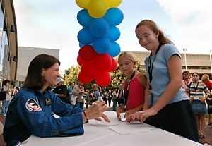 At the "Reach for the Stars" event at MIT, astronaut Sally Ride signs autographs for Arianna Schatzki-McClain (center) and Sarah Straubinger of Chenery Middle School in Belmont.