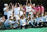 Members of the Ashdown Fire/Smoke team cheer for their teammate Irina Medvedev (S.B. 2001) who has just won the "Howard Sez" event, patterned after the children's game "Simon Says."