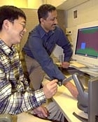 MIT graduate student Jung Kim and senior research scientist Mandayam A. Srinivasan demonstrate a transatlantic touch.