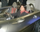 Angela Won, a senior in biology, tries out DaimlerChrysler's F-400 prototype car during the IAP trip to Germany.