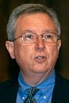 Executive Vice President John R. Curry speaks at MIT town meeting.