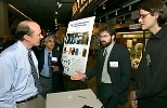 Eric Swanson of Sycamore Networks (left) and Mahendra Jain talk to Deshpande grant recipients Assistant Professor Fredo Durand (second from right) and visiting student Elmar Eisemann of the Laboratory for Computer Science at the Deshpande Center for Technological Innovation's first IdeaStream Symposium. The center was founded by Desh Deshpande, co-founder and chair of Sycamore Networks.
