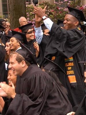 Members of the Class of 2003 cheer on one of their classmates during Commencement at MIT. <a onclick="MM_openBrWindow('01-comm-applause-enlarged.html','','width=509, height=583')"><span onmouseover="this.className='cursorChange';">Open image gallery</span></a><noscript> <a href="01-comm-applause-enlarged.html"><em>(no JavaScript)</em></a></noscript>
