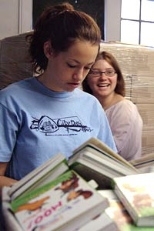 Above, freshman Sadie Wachter gets an encouraging smile from Alison Thronton, customer service representative and volunteer coordinator of the National Braille Press during CityDays.