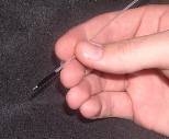 The Spectroscopy Lab developed a device that detects precancerous tissue by sequentially delivering laser light of 10 different colors to the tissue via an optical fiber probe. The probe, shown here, consists of a bundle of optical fibers with a diameter of just over 1mm, making it compatible with standard endoscopes. The returning light is collected using the same probe and analyzed with a spectr...