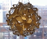 The finished polyhedron made of 30 double-headed wooden salamanders hangs in the office of Assistant Professor Erik Demaine overlooking the Stata Center, the sculpture's future home.