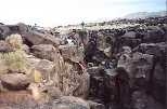 The class does some climbing at California's Fossil Falls, the remains of a waterfall carved by the Owens River thousands of years ago. Students found obsidian chips and places in the rock where women once ground grain at a Native American settlement on the river bank.