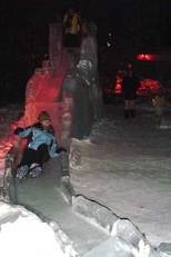 Freshman Holly Johnson slides down an ice slide at the Ice Art Park in Fairbanks.
