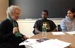 Margaret Atwood speaks with freshmen Linroy Marshall (center) and Tabitha Bonilla during a class visit.