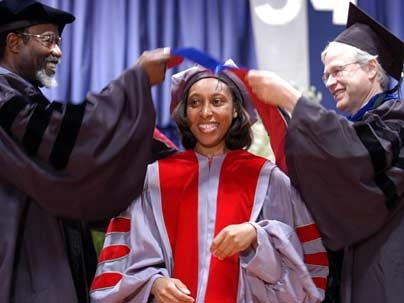 Ebonya Washington, center, is hooded by MIT Chancellor Phillip Clay, left, and Professor Bengt  Holmstrom, department head in the School of Humanities, Arts and Social Sciences. Washington earned her Ph.D. in economics. <a onclick="MM_openBrWindow('comm-main2-enlarged.html','','width=509, height=583')">
<span onmouseover="this.className='cursorChange';">Open image gallery</span>
</a>
<noscript> <a...