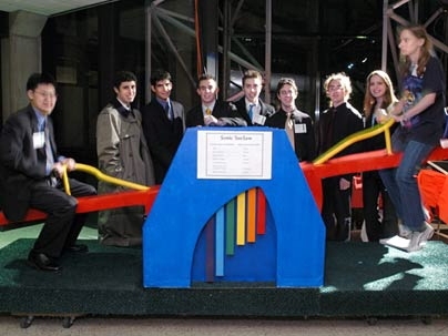 Douglass Hwang, left, and Marissa Jacovich, far right, try out their team's Sonic See-Saw. Between the two are, from left, Zachary Traina, Matthew Socks, Joe Audette, Aaron Sokoloski, Jeremy Schwartz, Ross Hatton and Meghan Gibbons