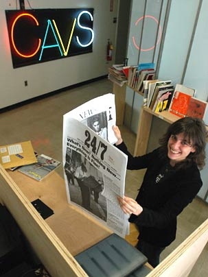 Larissa Harris, associate director of the Center for Advanced Visual Studies, checks out 24/7, a Lithuanian art periodical that is part of the Traveling Magazine Table exhibition hosted by the center.
