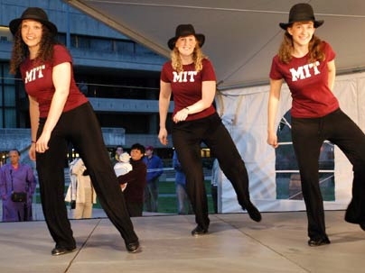 Tap dancers from the MIT Dance Ensemble add to festivities on Kresge Oval Monday night as a week of inaugural events got under way. From left, Kameka Dempsey, a graduate student at Harvard, is joined by MIT alumna Stephanie Chiesi (currently at Draper) and sophomore Anna Massie.