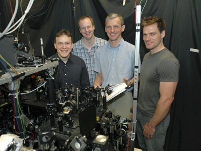 MIT Professor Wolfgang Ketterle, second from right, poses with three fellow researchers involved in the creation of a new form of matter, a superfluid gas of fermions. From left are Martin Zwierlein, Christian Schunck, Wolfgang Ketterle and Andre Schirotzek.