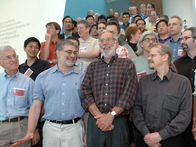 Dean of Science Robert J. Silbey (in checked shirt) stands amid a crowd of well-wishers who gathered at MIT's Stata Center on Friday, June 24, for a symposium in honor of the chemistry professor's 65th birthday.