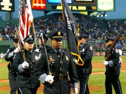 MIT's own police officers carry the colors on the field before the Red Sox game at Fenway Park on Tuesday, Aug. 30. Clockwise from center are Lt. Daniel Costa and Patrol Officers David Sacco, William Smith, Kevin O'Connor, Brian Sousa and Robert Molina.