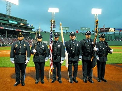 MIT police officers honor the flag at Fenway Park on Tuesday, Aug. 30. From left are Lt. Daniel Costa, Officers Dave Sacco, William Smith, Kevin O'Connor, Brian Sousa and Robert Molina.