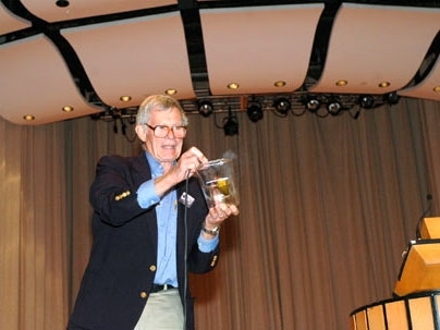 Physics Professor Emeritus John King runs electric current through a pickle, a demonstration he and Institute Professor Emeritus Philip Morrison used in their classes, at a memorial celebration for Morrison at Kresge Auditorium on Saturday, Sept. 10.