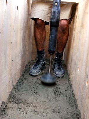 Dahmen uses a pneumatic compactor to pack the soil mixture.