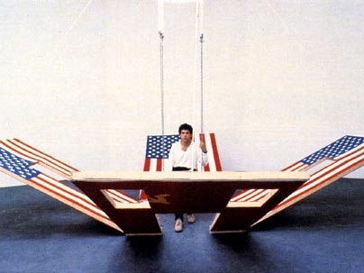 Vito Acconci's Instant House is a self-erecting architectural unit consisting of flags, wood, cables and pulleys. Acconci will speak at MIT next week.
